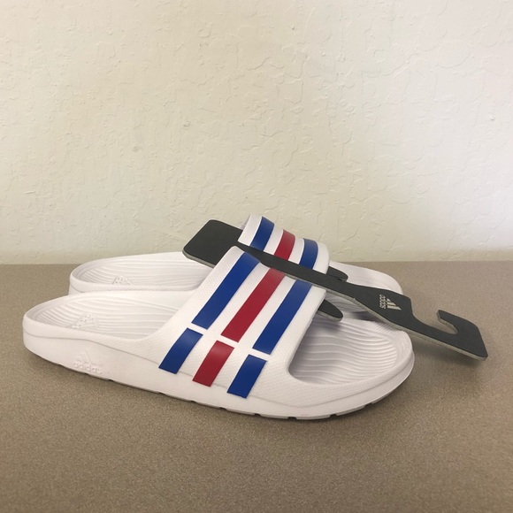 red white and blue adidas slides